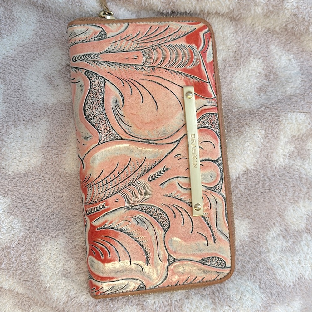 Pink and red Brahmin Suri zip around wallet. With outside zipper pocket.